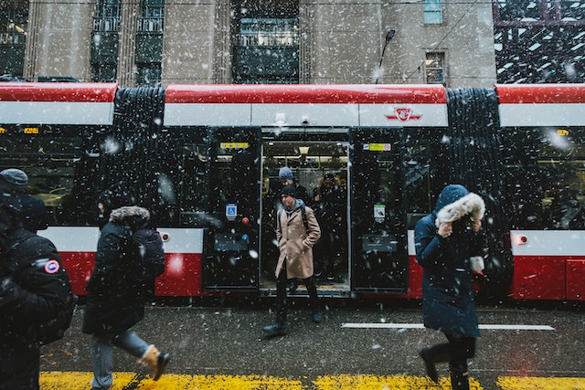 Stepping out of a train in snow
