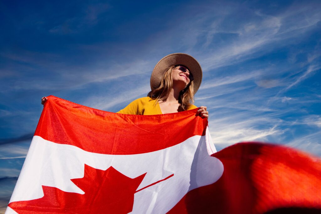 happy lady with canadian flag