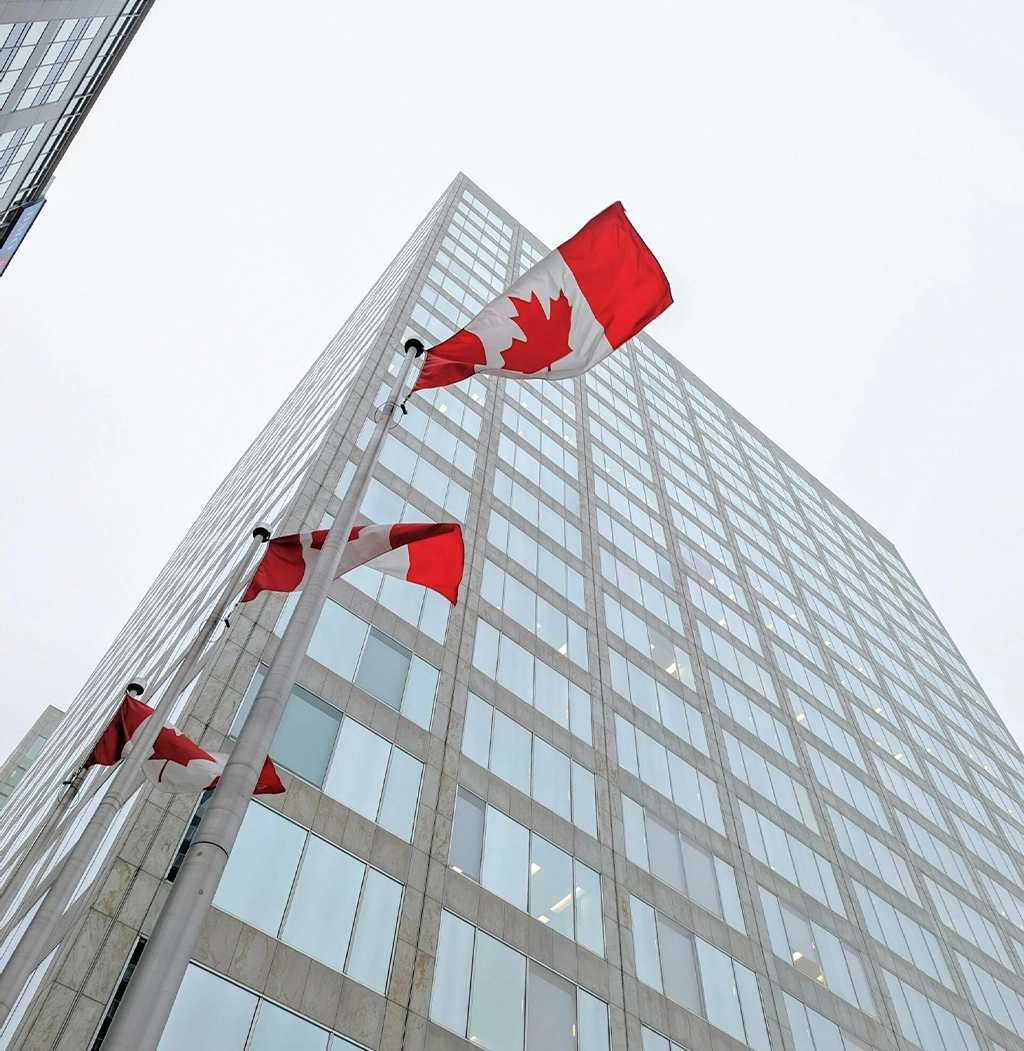 business building with canadian flags